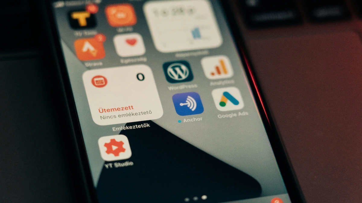 Smartphone home screen showing the WordPress app beside Google Analytics and Google Ads icons